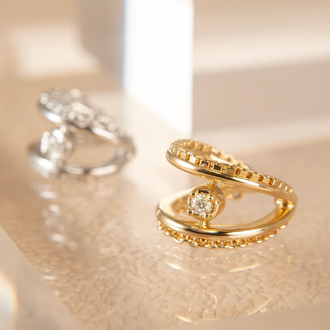 Cable and grid diamond ear cuff